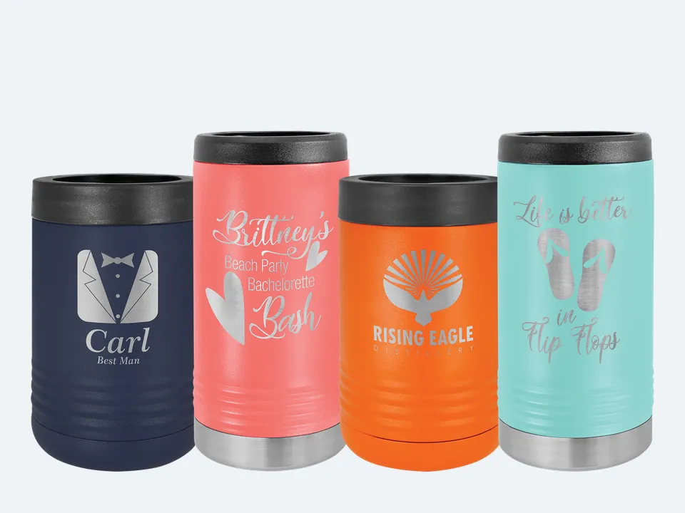 Four Polar Camel can coolers with sample engravings: a navy standard can cooler, a coral slim can cooler, an orange standard can cooler and a teal slim can cooler