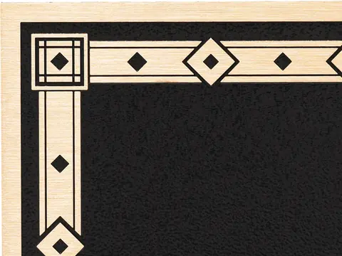 The corner of a sample plaque with the Jewel decorative border, a band of diamond shapes