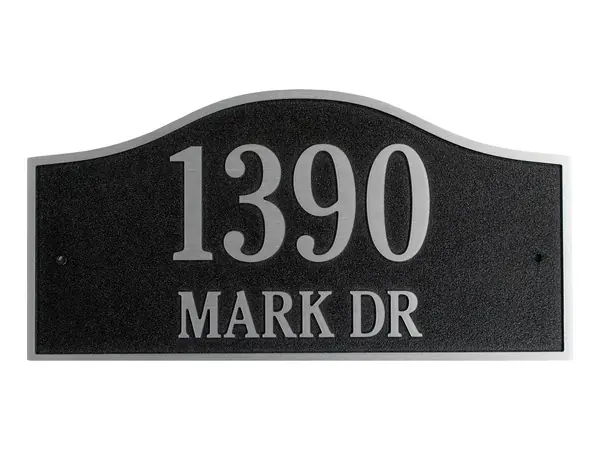An example of an arched black address plaque reading 1390 Mark Dr in raised silver numbers