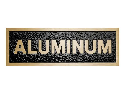 An aluminum sample plaque with a flash bronze finish, reading ALUMINUM in bronze toned letters