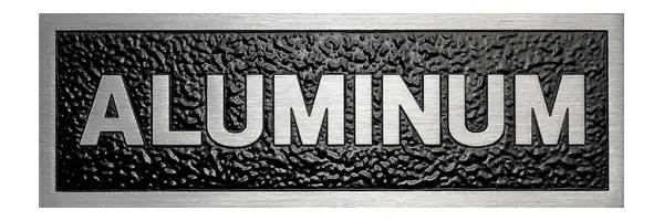 A sample plaque with the word ALUMINUM in raised silver letters on a black textured background