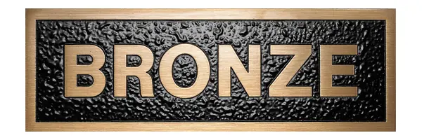 A sample plaque with the word BRONZE in raised bronze letters on a black textured background