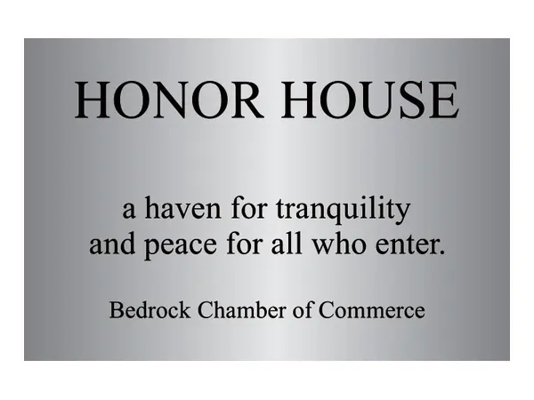 An example of an etched stainless steel plaque reading Honor House