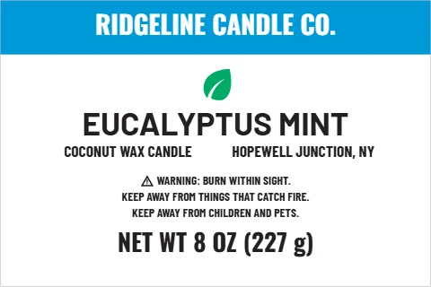 Roll label template, candle, clean and fresh, reading "RIDGELINE CANDLE CO.", "EUCALYPTUS MINT" and "NET WT 8 OZ (227 g)", in blue and white
